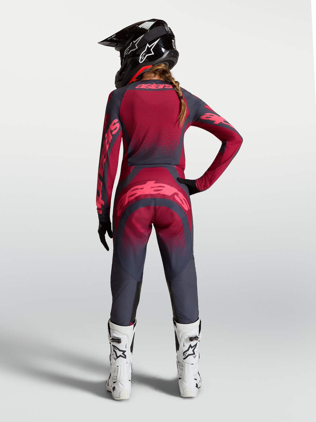 Alpinestars Stella Techstar Swan Jersey, women's crimson and dark gray motocross gear with ventilation, rear on-model view.