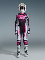 Alpinestars 2026 Woman Stella Techstar Nomur Gear Set, full motocross racing outfit in Black White and Fuchsia, jersey featuring a large star logo and pink splash design, matching pants, white helmet with goggles, black and white boots, coordinated women's off-road gear
