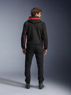 Alpinestars Chrome Air Sport Hoodie, Black and Red Fluo, back view of man wearing casual motorcycle jacket, featuring red Alpinestars branding on the hood and red mesh panels on the sleeves, paired with black pants.