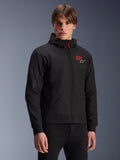 MM93 Radium Tech Hoodie, black urban motorcycle zip-up jacket, red 93 and white Alpinestars logo on chest, worn by model with black pants, featuring a removable hood with red drawstrings and sleeve branding, casual motorsport-inspired design