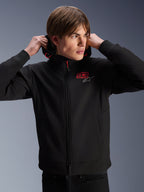 Alpinestars MM93 Radium Tech Hoodie, urban motorcycle jacket, black with red and silver logos, worn by a male model, features a full-length zipper and ribbed cuffs, casual lifestyle motorsport apparel