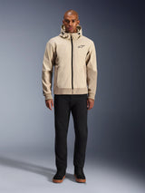 Alpinestars Radium Tech Hoodie in Mastic Aluminum, urban motorcycle hoodie worn by a male model with black pants and black boots, featuring a full-length black zipper, small chest logo, and athletic fit for city riding.