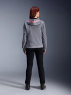 Alpinestars Stella Chrome V2 Sport Hoodie, Women's Motorcycle Hoodie, Gray Heather and Pink Fluo, back view showing pink Alpinestars logo on the hood, worn with black riding pants and boots, casual motorcycle apparel for women
