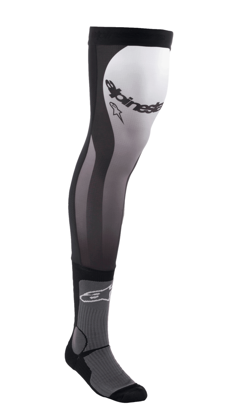 Alpinestars Knee Brace Socks, long motocross riding socks, Black White and Gray, over-the-knee design with stretch Lycra upper, mesh inserts, ribbed ankle padding, and Alpinestars branding on the thigh