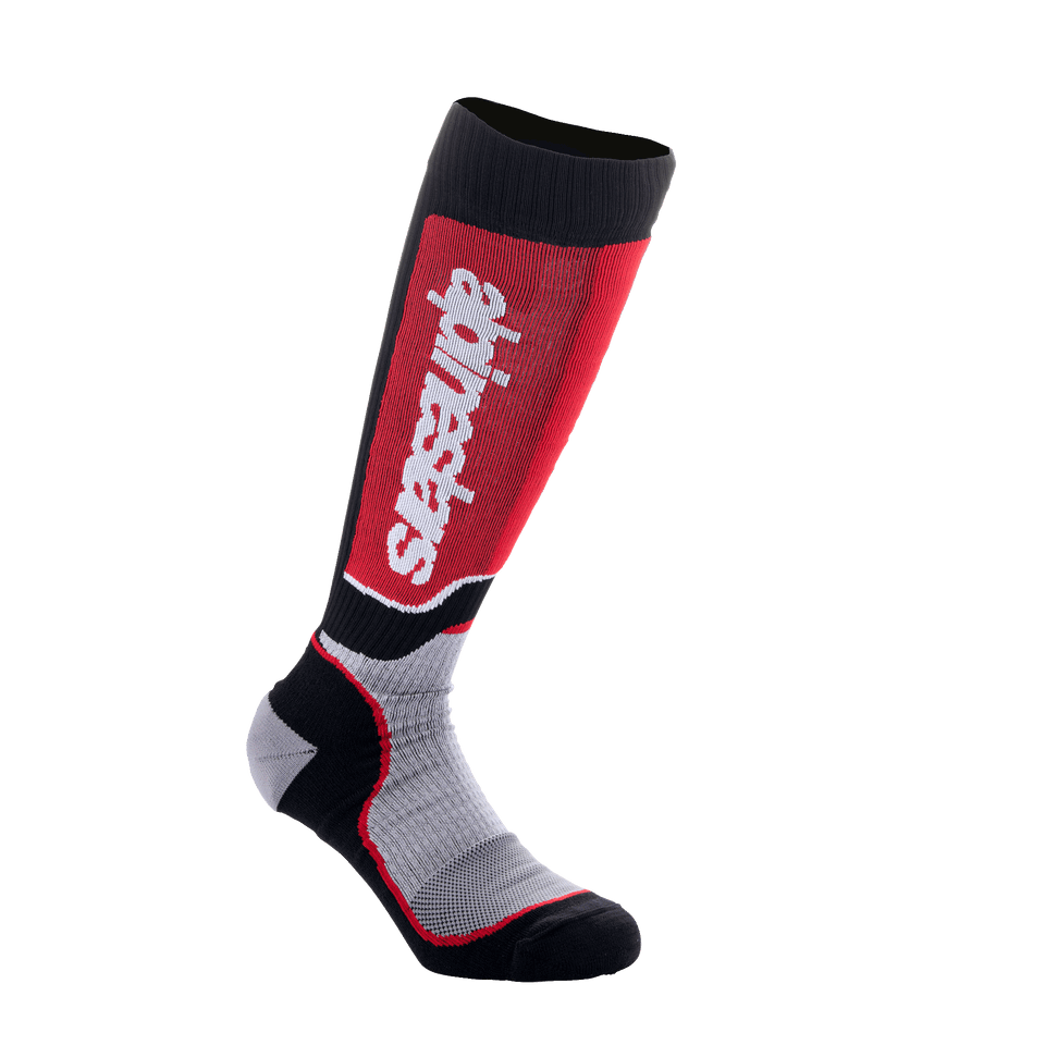 Alpinestars Youth MX Plus Socks, Motocross Riding Socks, Black Gray and Red, featuring vertical white logo on red shin panel, technical single-layer construction with breathable mesh zones, designed for off-road motorcycle boots