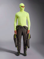 Alpinestars ZX Evo V3 Long Sleeve Top, Yellow Fluo, worn with matching balaclava and dark racing suit tied at waist, lightweight flame-resistant base layer for auto racing, featuring Alpinestars logos on the collar and shoulders