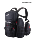 Alpinestars Techdura Tactical Pack, modular off-road and enduro backpack, Black with white Alpinestars logo, featuring MOLLE webbing, multiple removable pouches, and heavy-duty poly-fabric construction for trail storage.