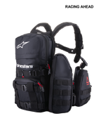 Alpinestars Techdura Tactical Pack, modular off-road and enduro backpack, Black with white Alpinestars logo, featuring MOLLE webbing, multiple removable pouches, and heavy-duty poly-fabric construction for trail storage.
