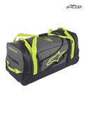 Alpinestars Komodo Travel Bag, durable motorsport gear bag and luggage, black and anthracite with yellow fluo straps and logo branding, waterproof bottom panel for racing and adventure travel