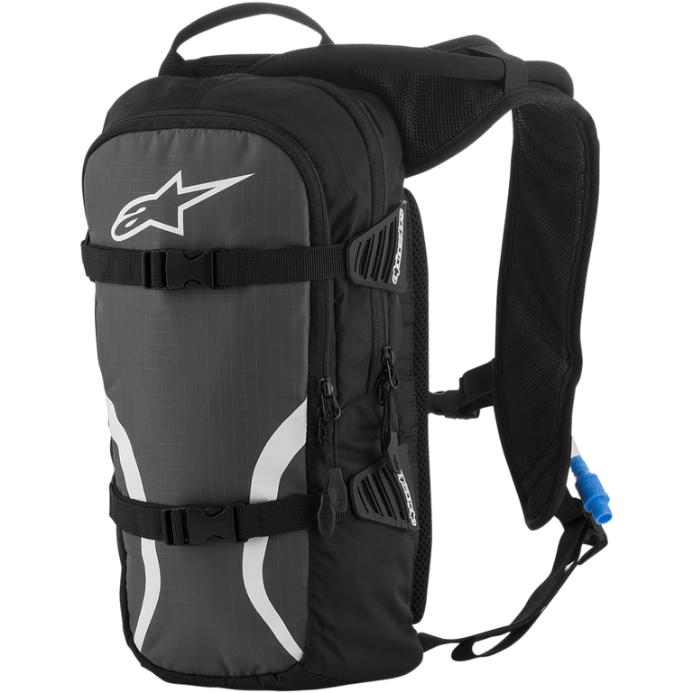 Alpinestars Iguana Hydration Backpack, Off-Road Hydration Pack, Black Anthracite and White, featuring padded mesh shoulder straps, front compression straps with buckles, zippered compartments, and a blue hydration tube with nozzle