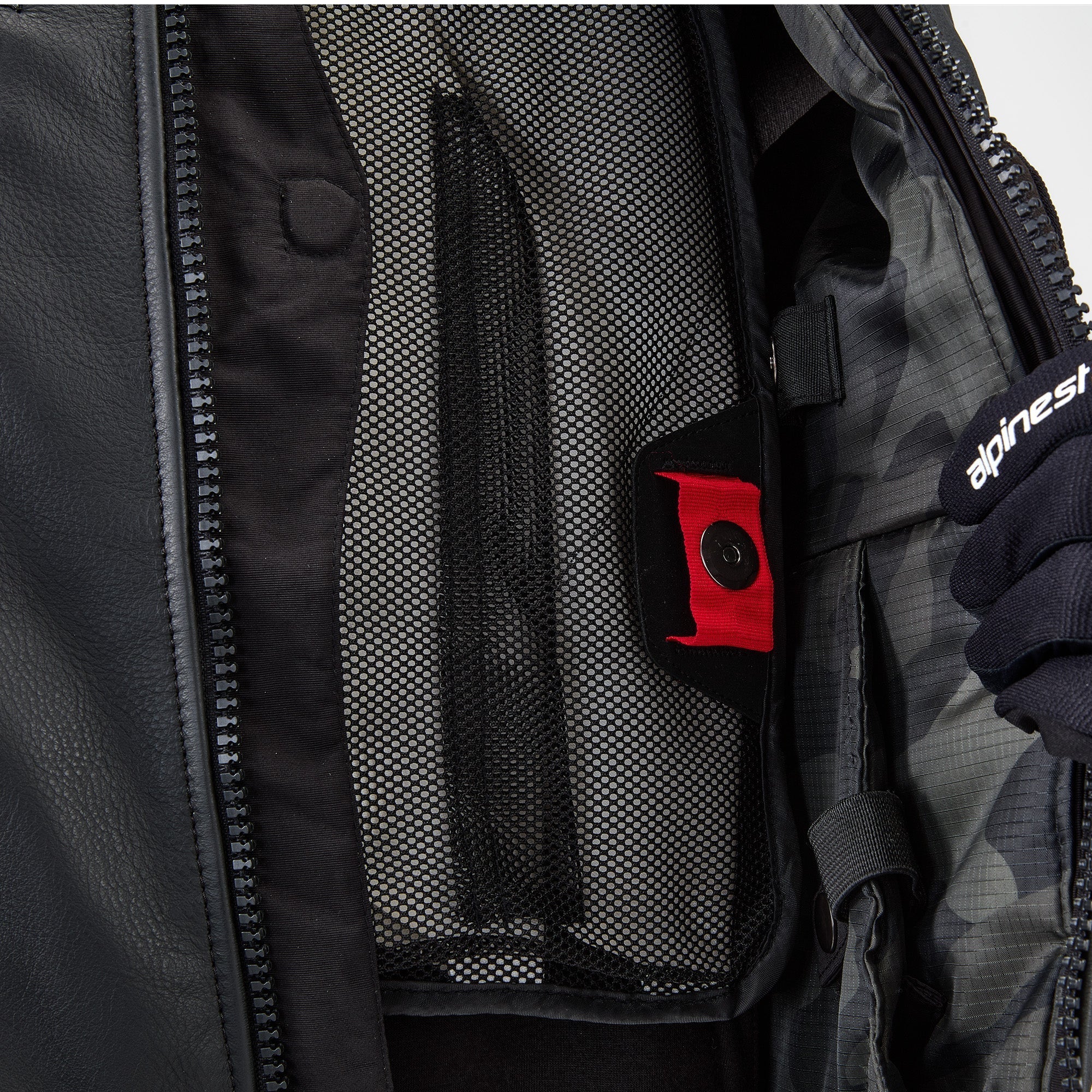 Alpinestars Tech-Air 3 Leather System, black motorcycle airbag vest with interior mesh pocket and red pull tab detail.