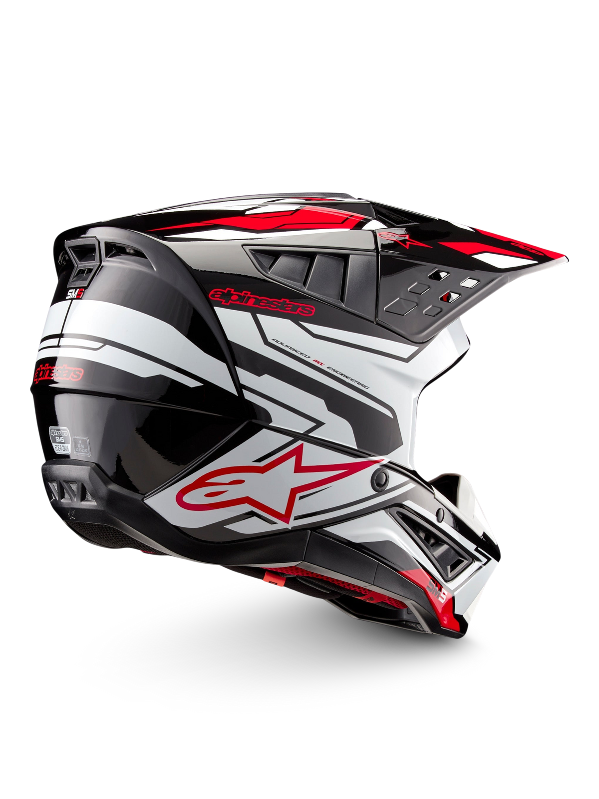 Alpinestars S-M5 Action 2 Helmet, motocross helmet in glossy black, white and bright red, side view with peak visor, ventilation openings and graphic detailing.