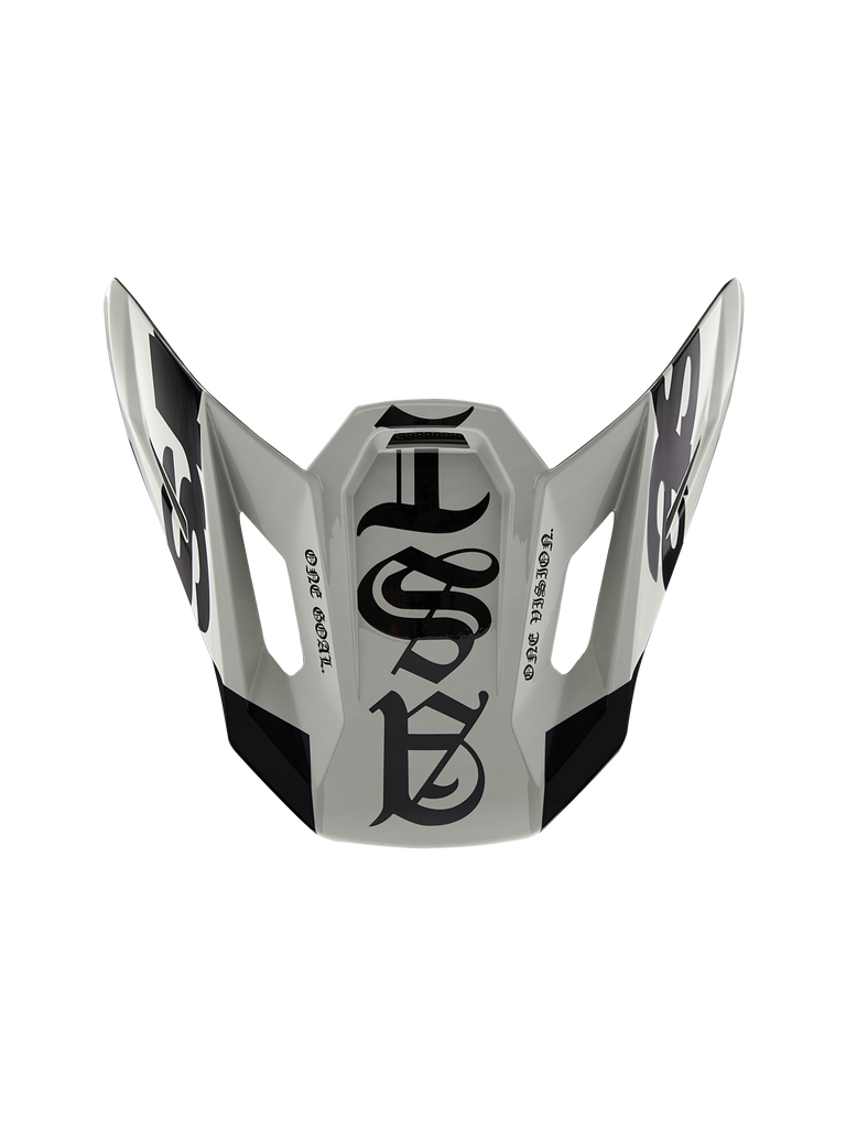 Alpinestars Limited Edition S-M7 Wolf Dust Visor 22.06, Motocross Helmet Replacement Peak, Dune and Black Glossy, featuring gothic-style graphics and 'ONE GOAL' 'ONE VISION' text, aerodynamic design for off-road racing