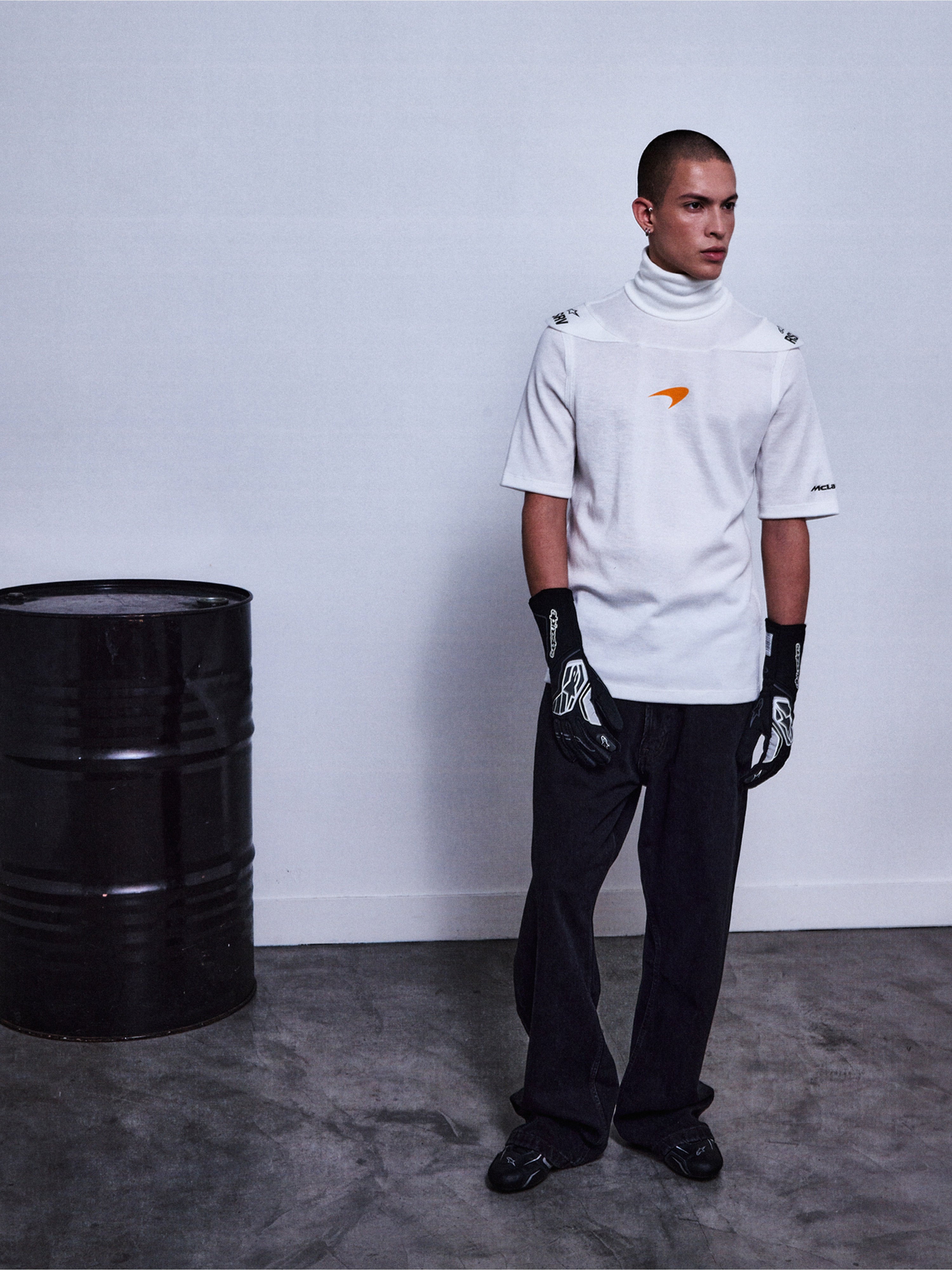 RSRV Pyro SS Tee, White Short Sleeve Turtleneck with Orange Logo, Lifestyle Streetwear, Premium Cotton Construction, Styled with Black Pants and Patterned Gloves
