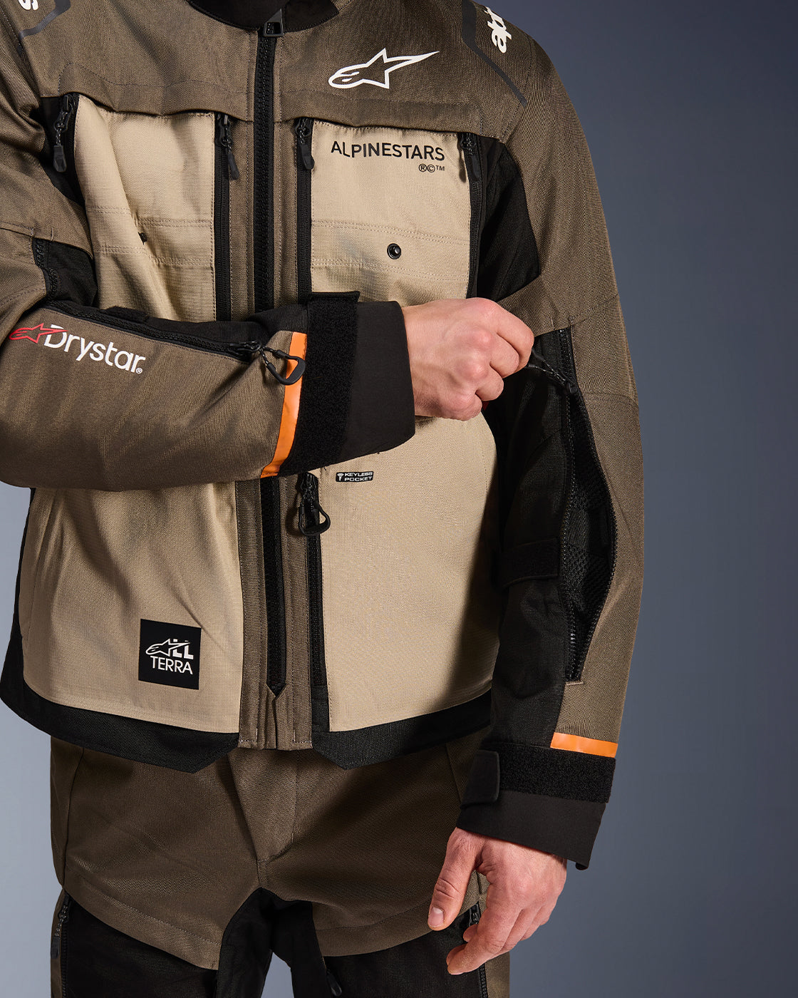 Alpinestars Cusco Drystar Jacket, Adventure Touring, Brown and Black, showing zippered sleeve ventilation detail.