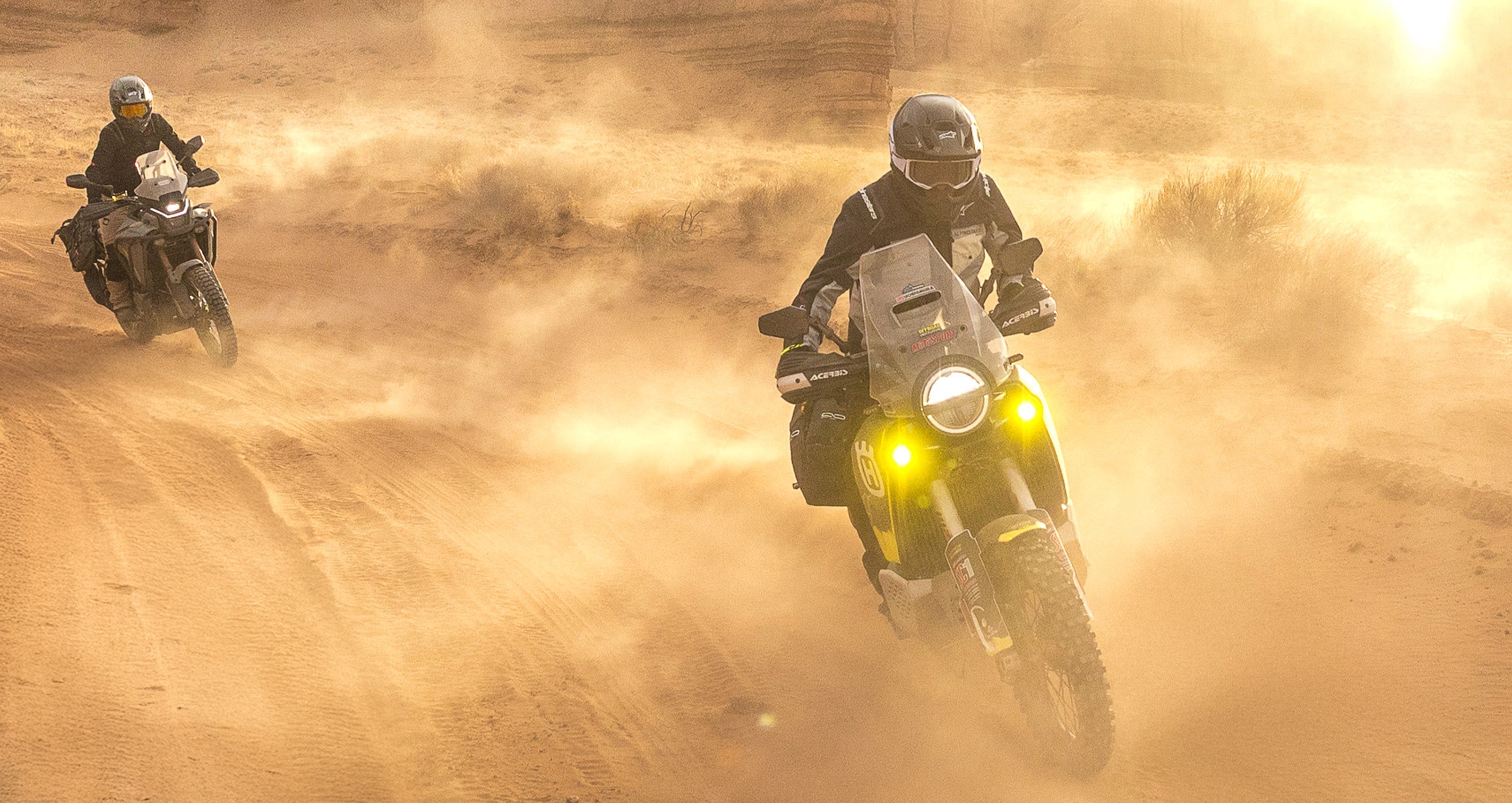 Alpinestars Cusco Drystar Jacket AND Cusco Drystar Pants, gray adventure motorcycle gear in dusty desert terrain.