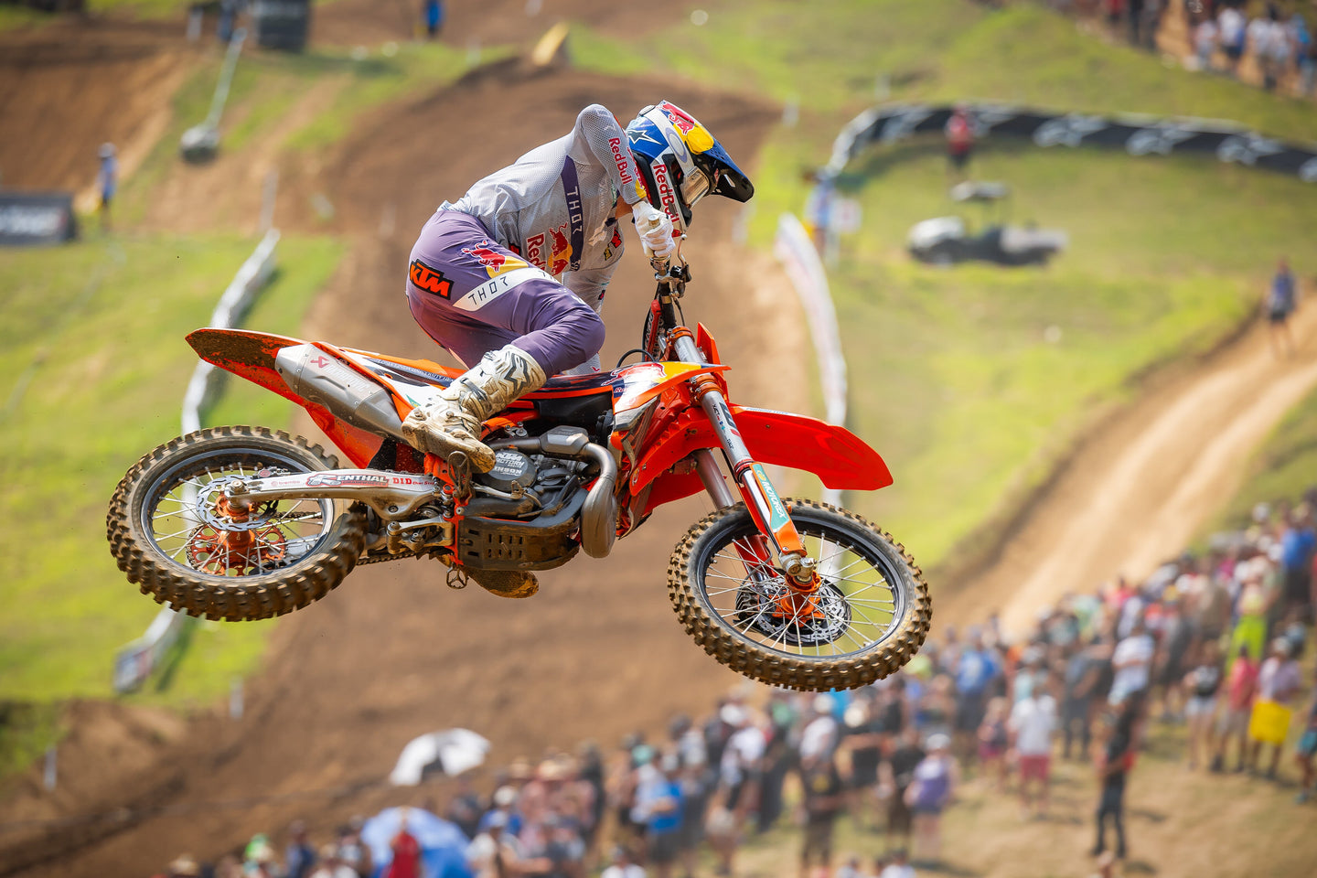 Aaron Plessinger performing a stunt on his mx bike while wearing Alpinestars clothing and protections