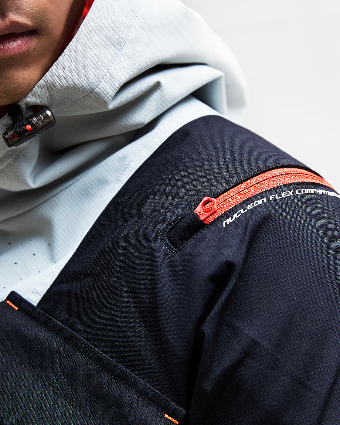 Alpinestars Mogress Air Jacket, black urban motorcycle jacket with red Nucleon Flex protector zipper detail.