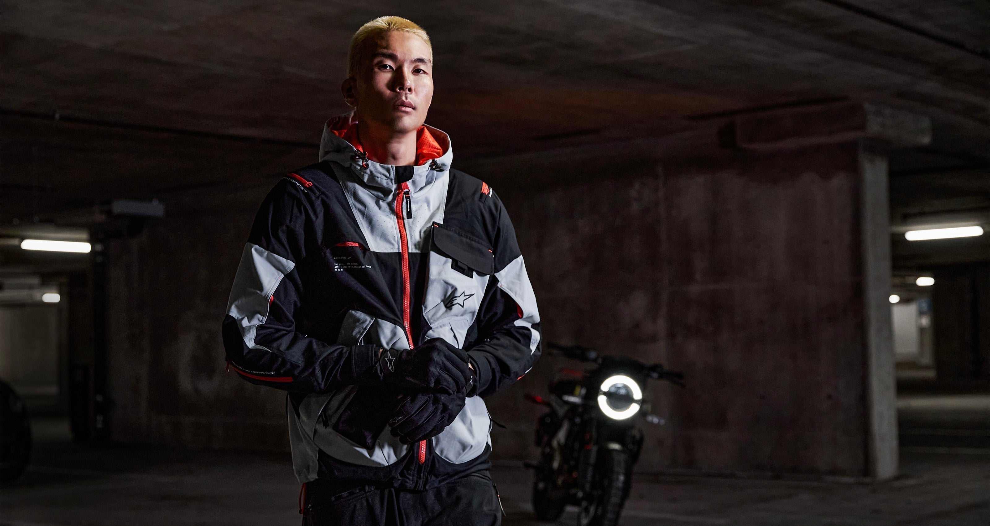 Alpinestars Mogress Air Jacket, Men's Urban Motorcycle Textile Jacket, Blue Almond and Black with orange accents.