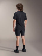 Alpinestars A-Dura Liner Shorts, Black Cycling Liner Shorts, back view on model, tight-fitting stretch fabric with visible chamois padding seams, paired with a black t-shirt and cycling shoes, mountain bike apparel