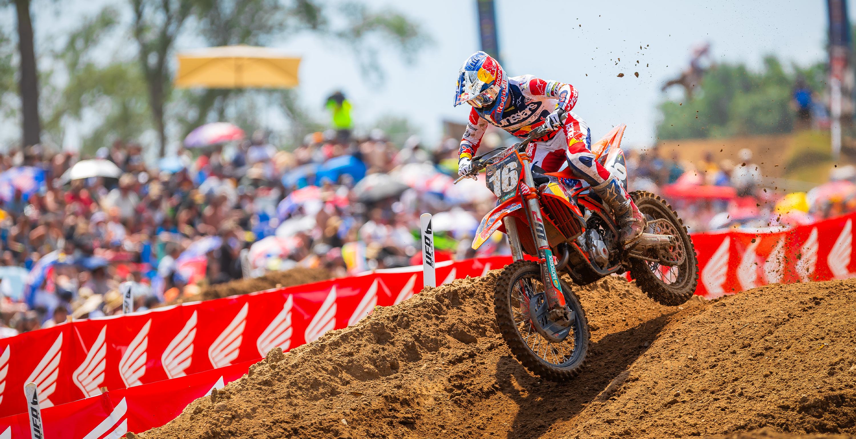 Motocross rider Tom Vialle on a dirt bike wearing full Alpinestars mx gear during a race with a blurred background