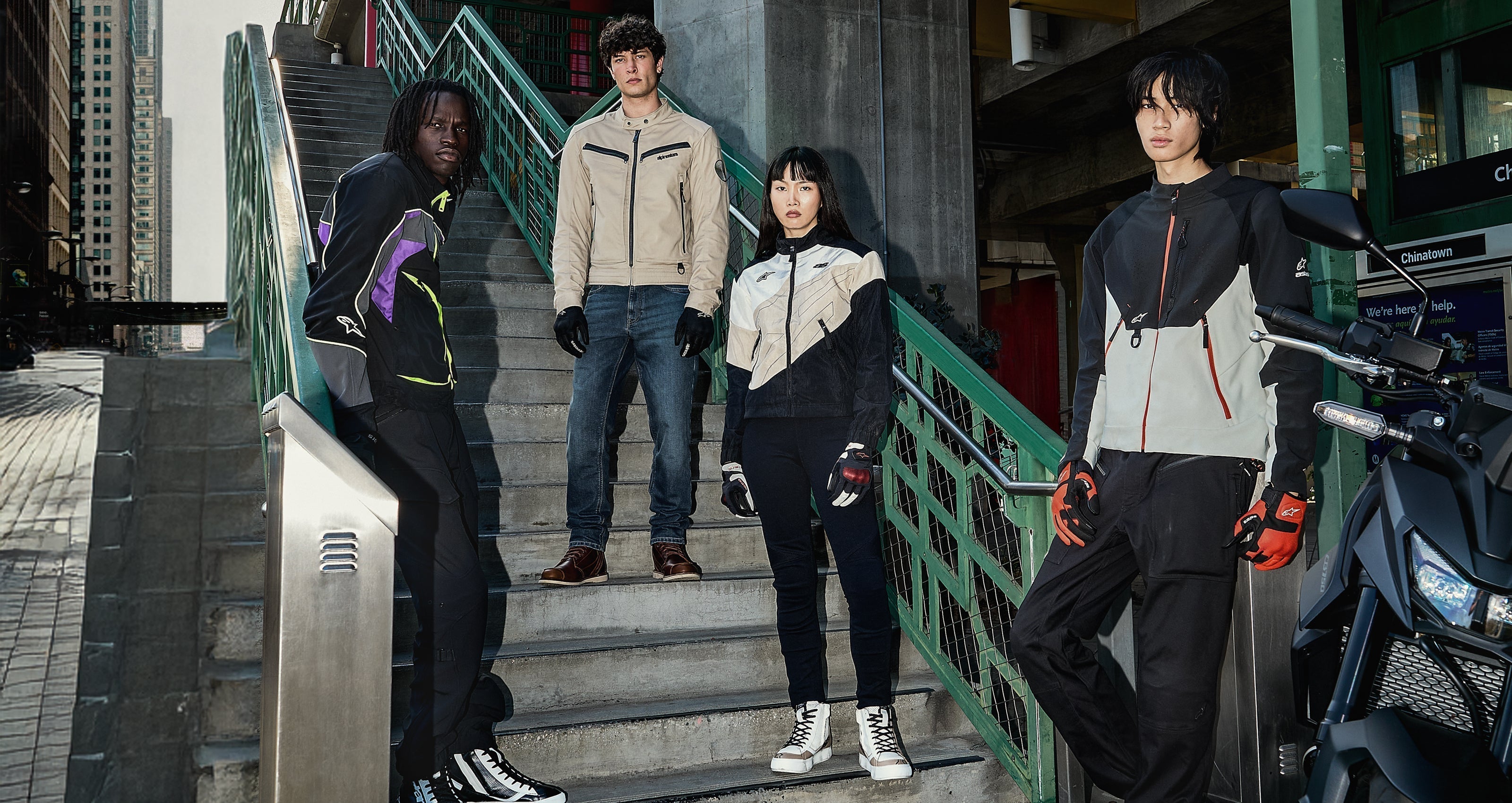 Alpinestars Stella Moshell Jacket, women's black and pink motorcycle gear, featured in an urban lifestyle group shot.