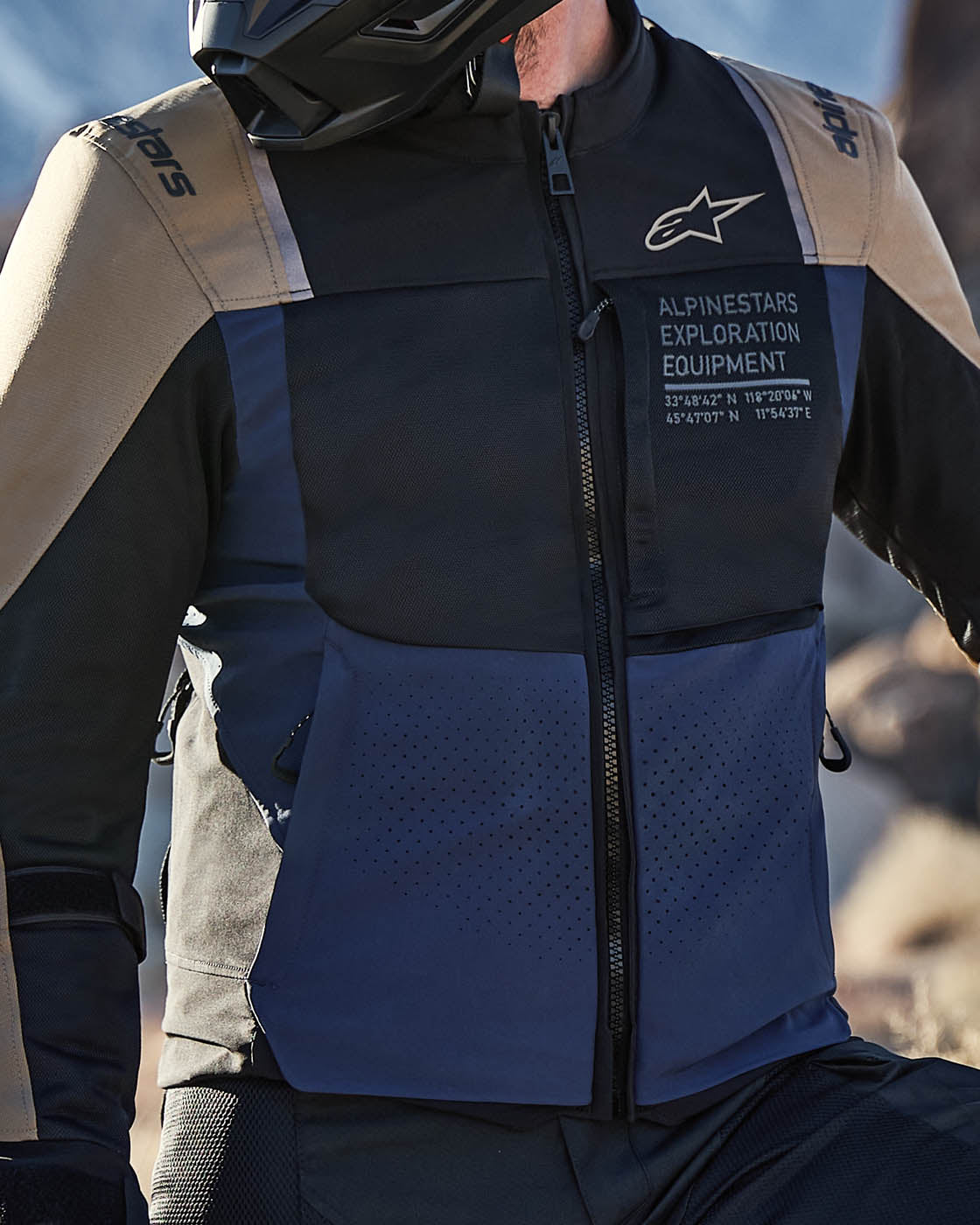 Alpinestars ST-2 Air Jacket in blue and black, showing mesh ventilation and laser perforations for adventure touring.