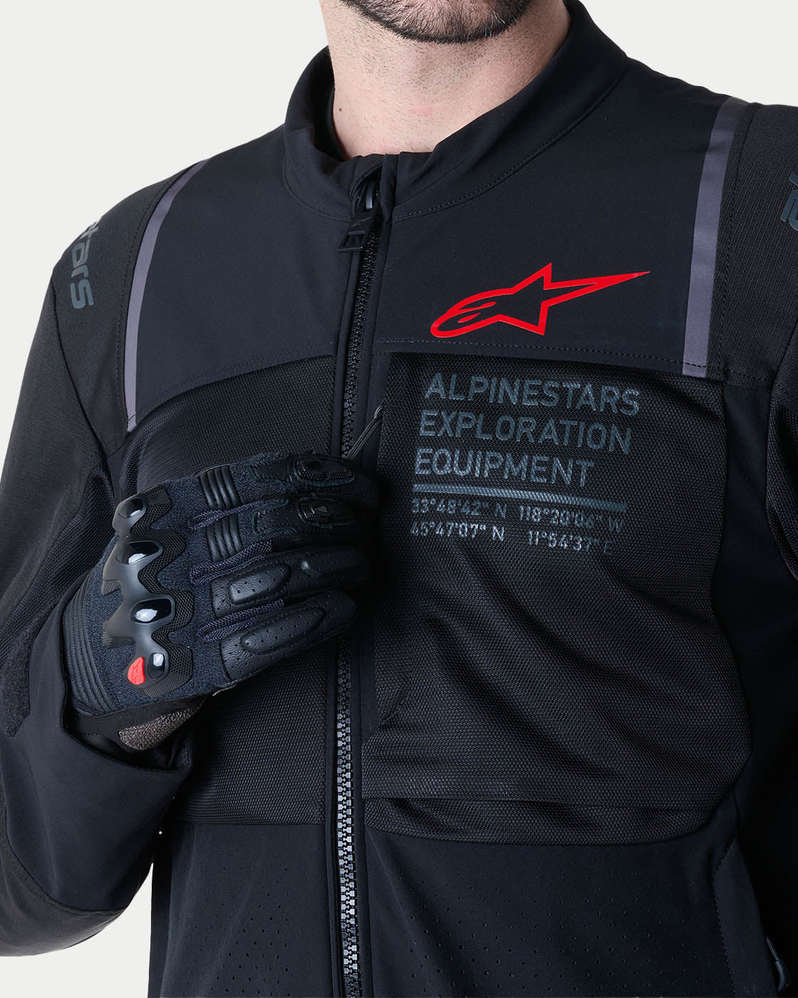 Alpinestars ST-2 Air Jacket, gray and red mesh motorcycle jacket with zippered pocket and exploration branding detail.